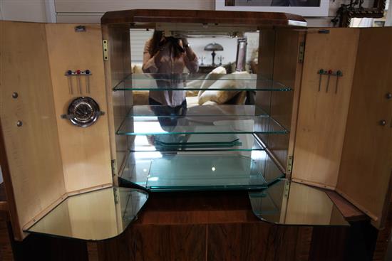 An Art Deco figured walnut cocktail cabinet, W.5ft 10in. D.1ft 6in. H.5ft 1in.